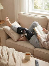 Person wearing Flexa Hinged Brace at home, all-day comfort with structured support